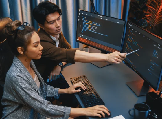 Developer working on a Rust application with code and system architecture elements around them